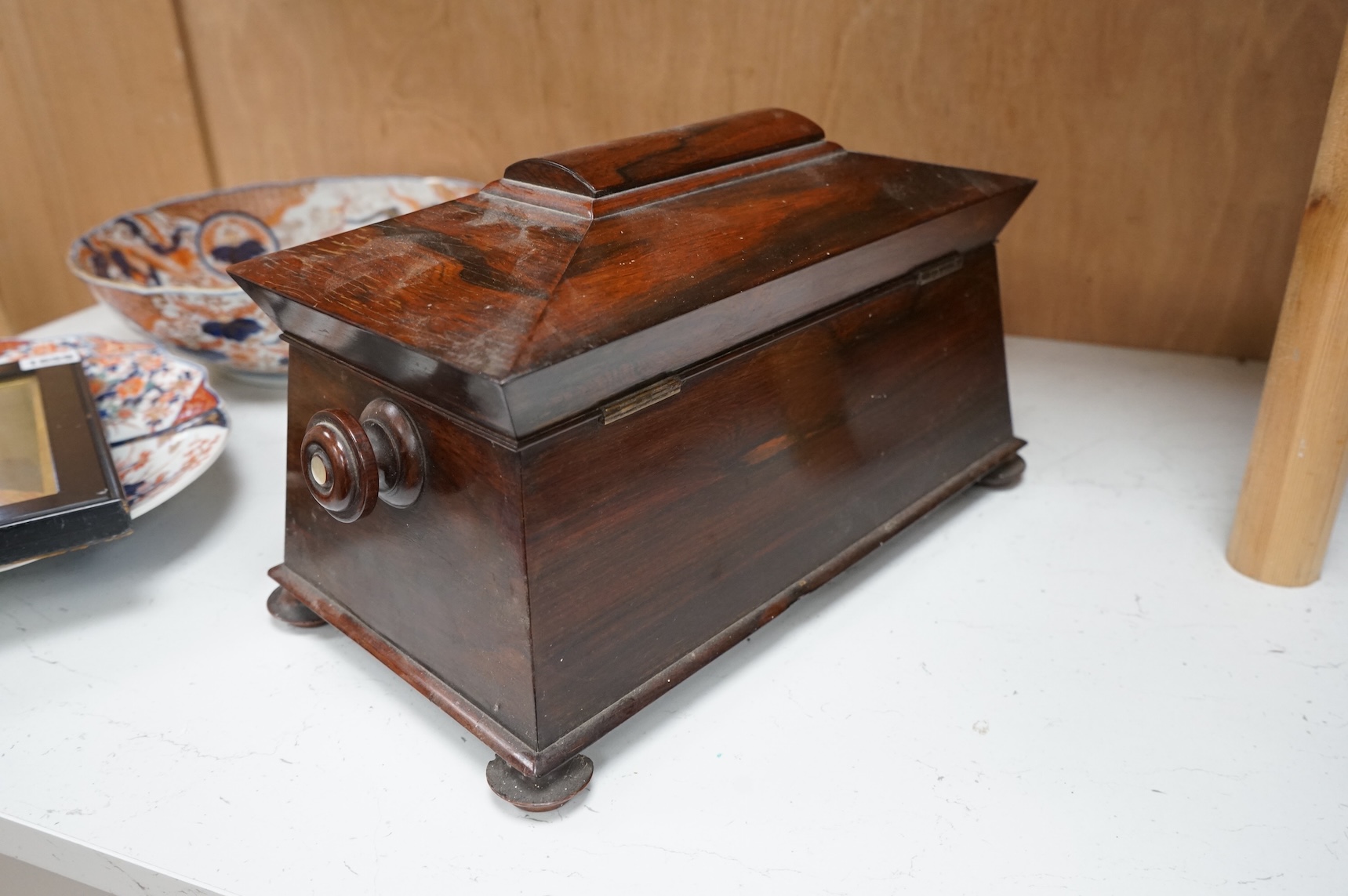 An early 19th century rosewood sarcophagus tea caddy, 39cm wide